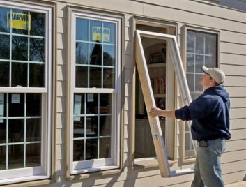 AVI professional installing Marvin double hung windows