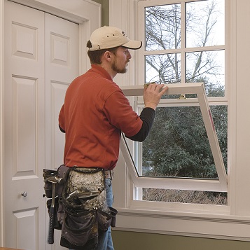 AVI Windows & Doors professional window installer installing a double hung window