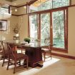 Wooden tilt turn windows in dining room