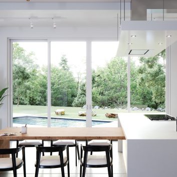 Sliding glass patio door in dining room leading to backyard