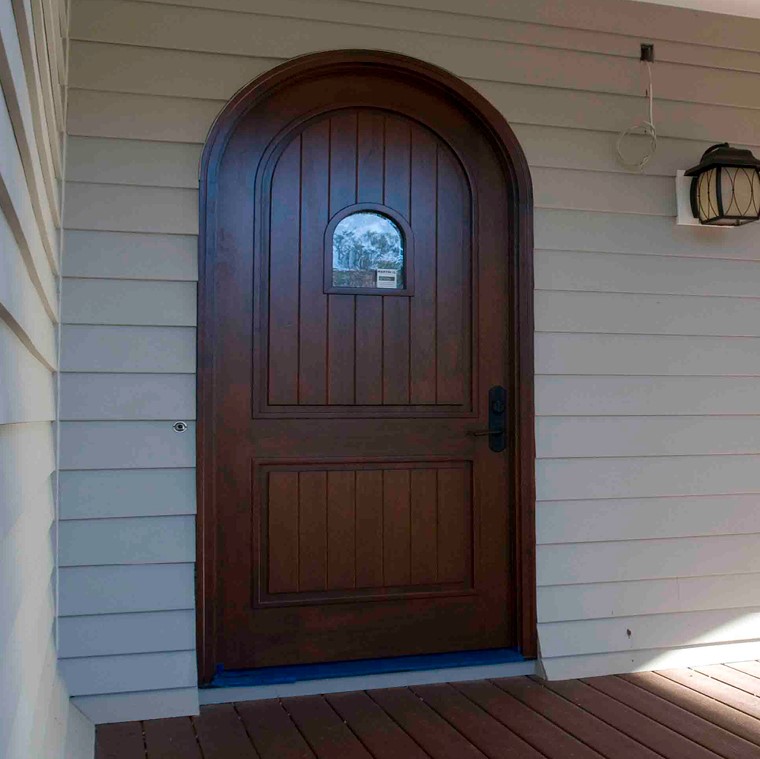 Custom shape front entrance door in wood